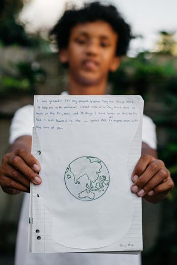 Boy holding a journal