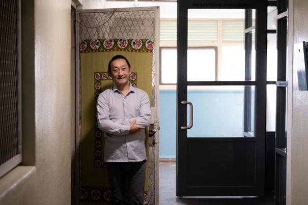 Man standing by a window