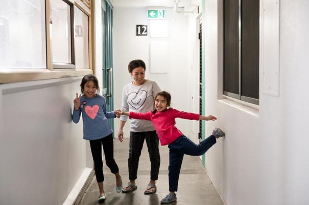 Woman and children in a hallway