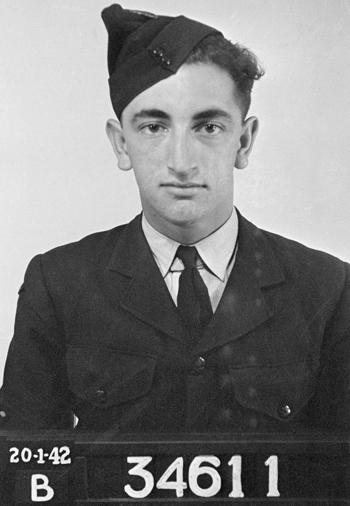 A black and white photograph of a young man in uniform
