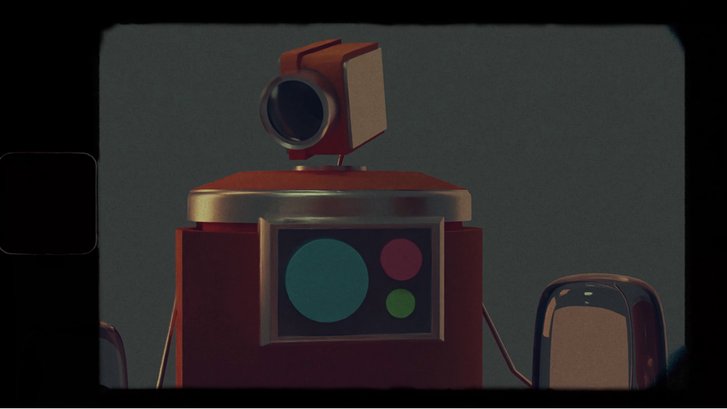 The still shows an animated robot. The robot’s head resembles a film camera, and the shot is stylised like an analogue film still with a black border.
