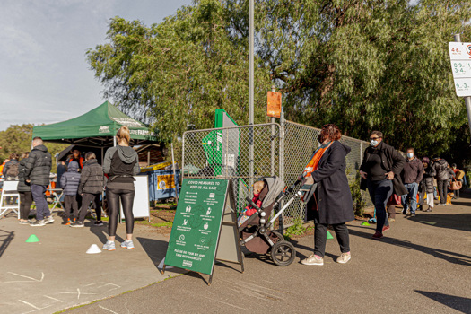 People lining up to attend a farmers market