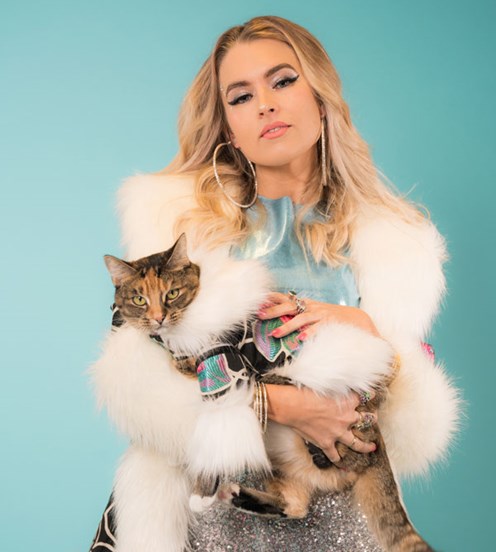 Portrait of a woman holding a cat