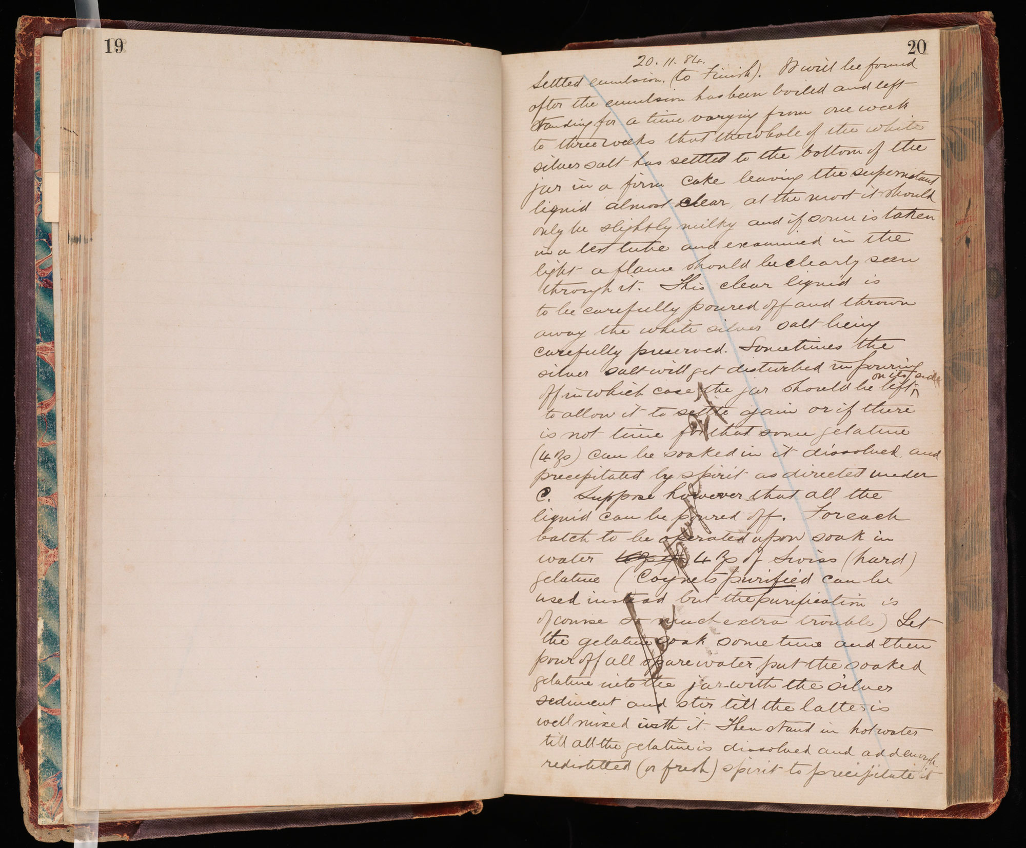 Pages of a hard cover notebook with handwritten notes on the left page 