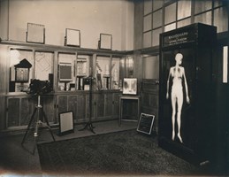 Medical imaging sales showroom, which features a wall cabinet containing x-ray screens, film and other Kodak x-ray products. 
