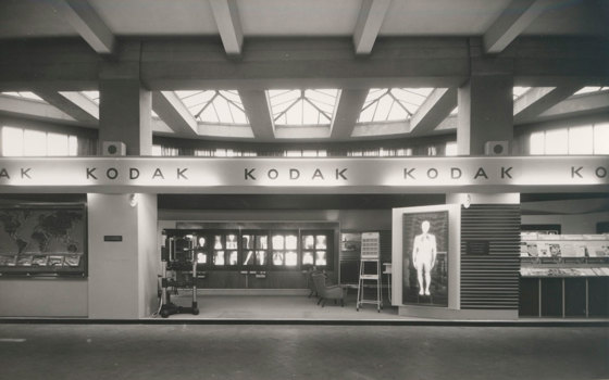Kodak exhibition stand. X-Ray images displayed throughout, with chairs and medical imaging equipment arranged around the space.