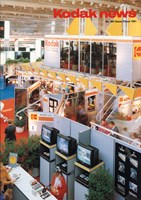 A view from above showing a Kodak exhibition display. There are television sets amongst bright yellow and red graphics