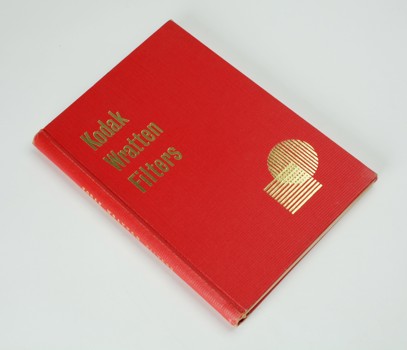 Red hardcover book with gold print on the front cover and down the spine