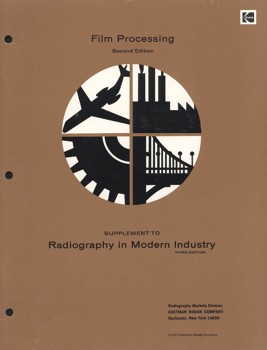 Booklet with a brown with a circular graphic on the cover divided into four quarters, each with a different graphic representation of an industry eg. an aeroplane and a factory.
