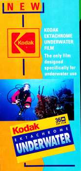 Glossy fold-out colour paper brochure with image of scuba diver on cover. Printed in red, yellow and blue colour scheme.