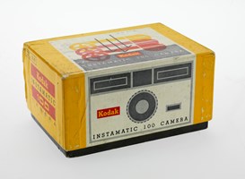 Yellow camera box with a graphic illustration of the camera on the box