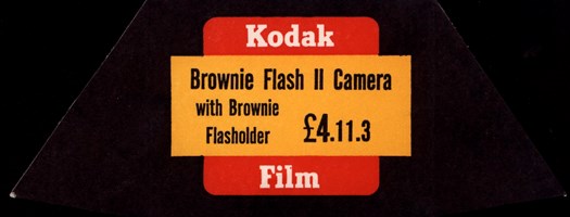Black, red and yellow price ticket for a Brownie Flash II camera
