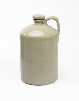 Cream stoneware jar with handle and a round lid that screws into the neck of the jar.