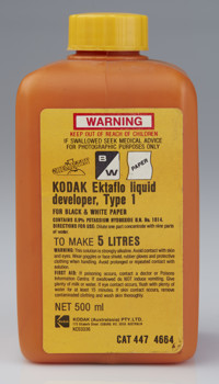 Orange square 500ml bottle with a yellow cap and label