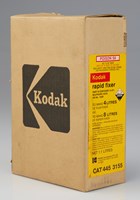 Tall flat box with the kodak logo printed in black on the side. There is yellow label printed in red and black