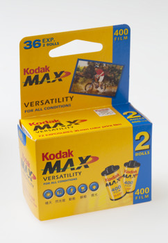 Small yellow box. Yellow, blue, red and black colour scheme. There is  a picture of film canister and a person riding a bike on the front