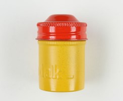 Small yellow metal round canister with a red lid