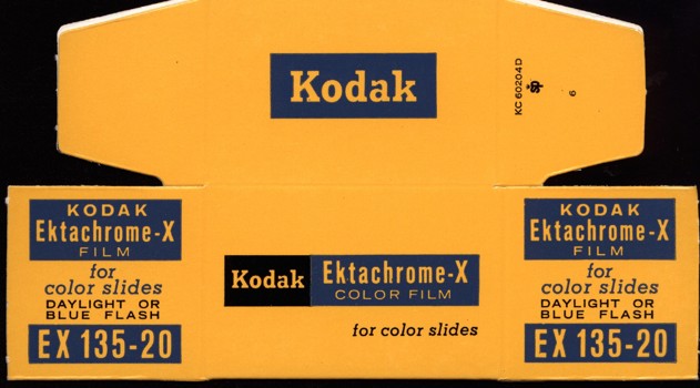 Flat, unused cardboard box printed in yellow, black and blue colour scheme.