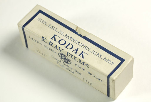 Empty white cardboard box; opened; printed in blue and white colour scheme.