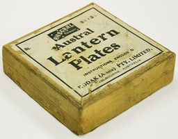 Yellowish box with a white paper label and black text