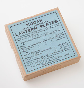Cardboard box with a blue label with black print