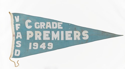 Blue flag with white text "VFASD C GRADE PREMIERS 1949"