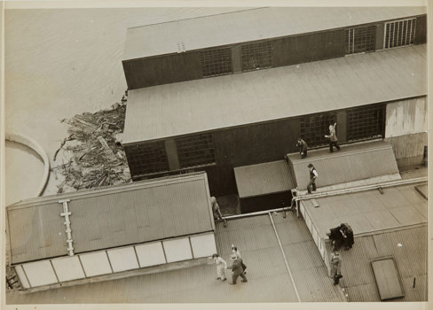 Building partially submerged in water.