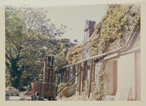 Forklift infront of brick building