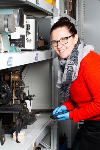 Portrait of Jennifer McNair, Collection Manager, Kodak Heritage Collection team member in collection store