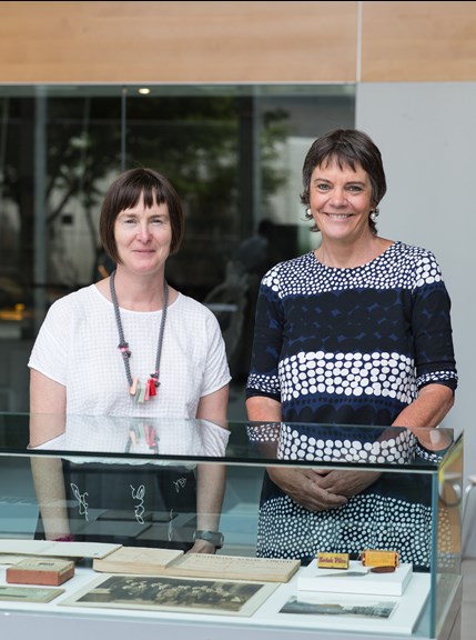 Curator Fiona Kinsey and former Kodak employee Kate Metcalf with a display case in the 10th Anniversary of the Kodak Collection exhibition at Melbourne Museum