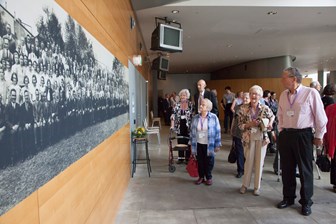 Former Kodak employees viewing historic staff panorama portrait at the 10th Anniversary of the Kodak Collection mini-exhibition at Melbourne Museum