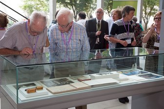 Former Kodak employees viewing display cases at the 10th Anniversary of the Kodak Collection mini-exhibition at Melbourne Museum