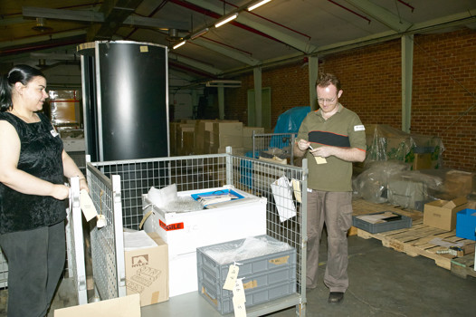 Museum Victoria collection management staff packing objects at the old Kodak Factory site, Coburg, for transfer to the museum
