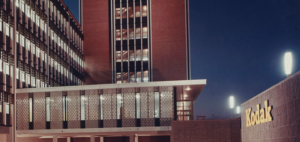 Exterior of a 1950s office building at night