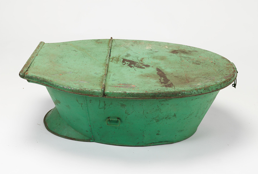 Green painted metal travel bath with lid.