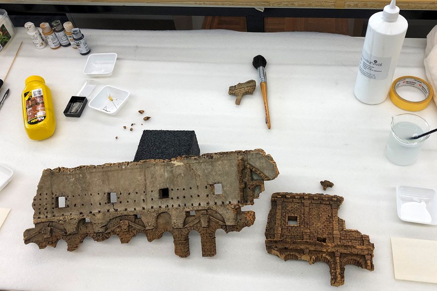 Large pieces broken off of a cork colosseum model 