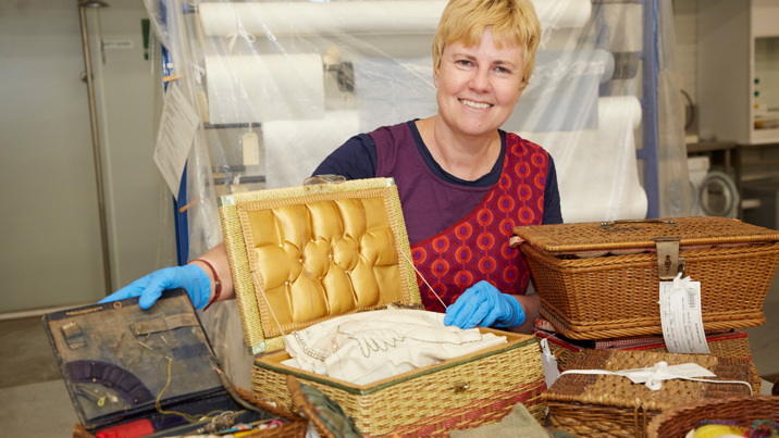 Curator Moya McFadzean with newly acquired objects belonging to artist Mirka Mora 