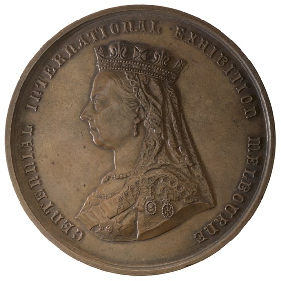 round disc depicting the queen's profile