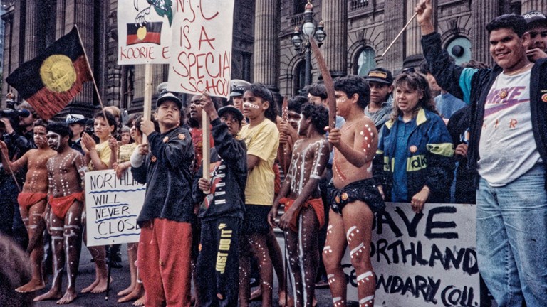 Group of First Peoples demonstrating on the steps of parliament house