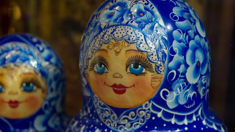 Detail of the heads of Matryoshka dolls painted blue and white