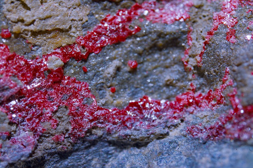a rock with a bright red streak across it
