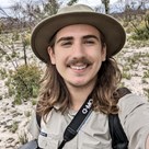 Man wearing a hat and smiling