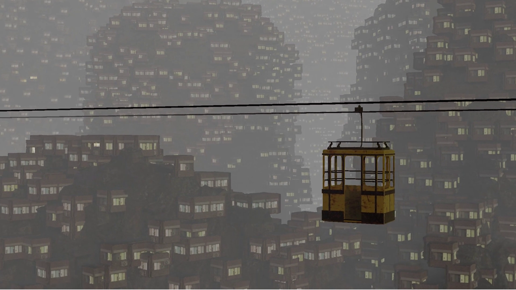 A cable cart travels across two wires above a condensed city. There are hundreds of houses are packed close together with the lights on.