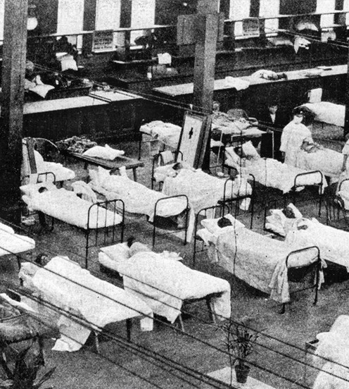 Hospital beds line the Exhibition Building's great hall during the influenza pandemic in 1919.