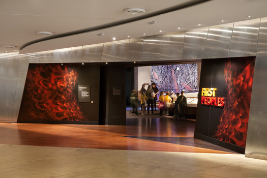 Group of school children in the entrance of a museum gallery
