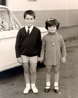 Young boy and girl holding hands