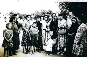 Group of people of varying ages posed for photograph.