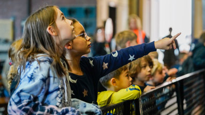 students point at the steam engines 