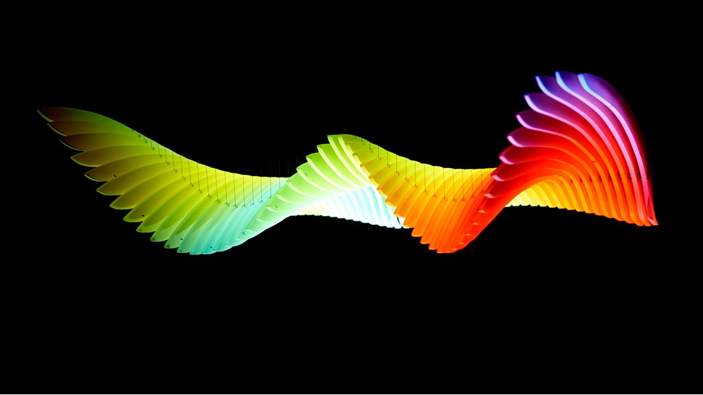 Wing shaped kinetic sculpture with colourful lighting