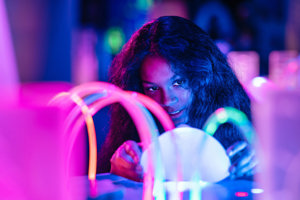 A child looks at a series of light tubes.